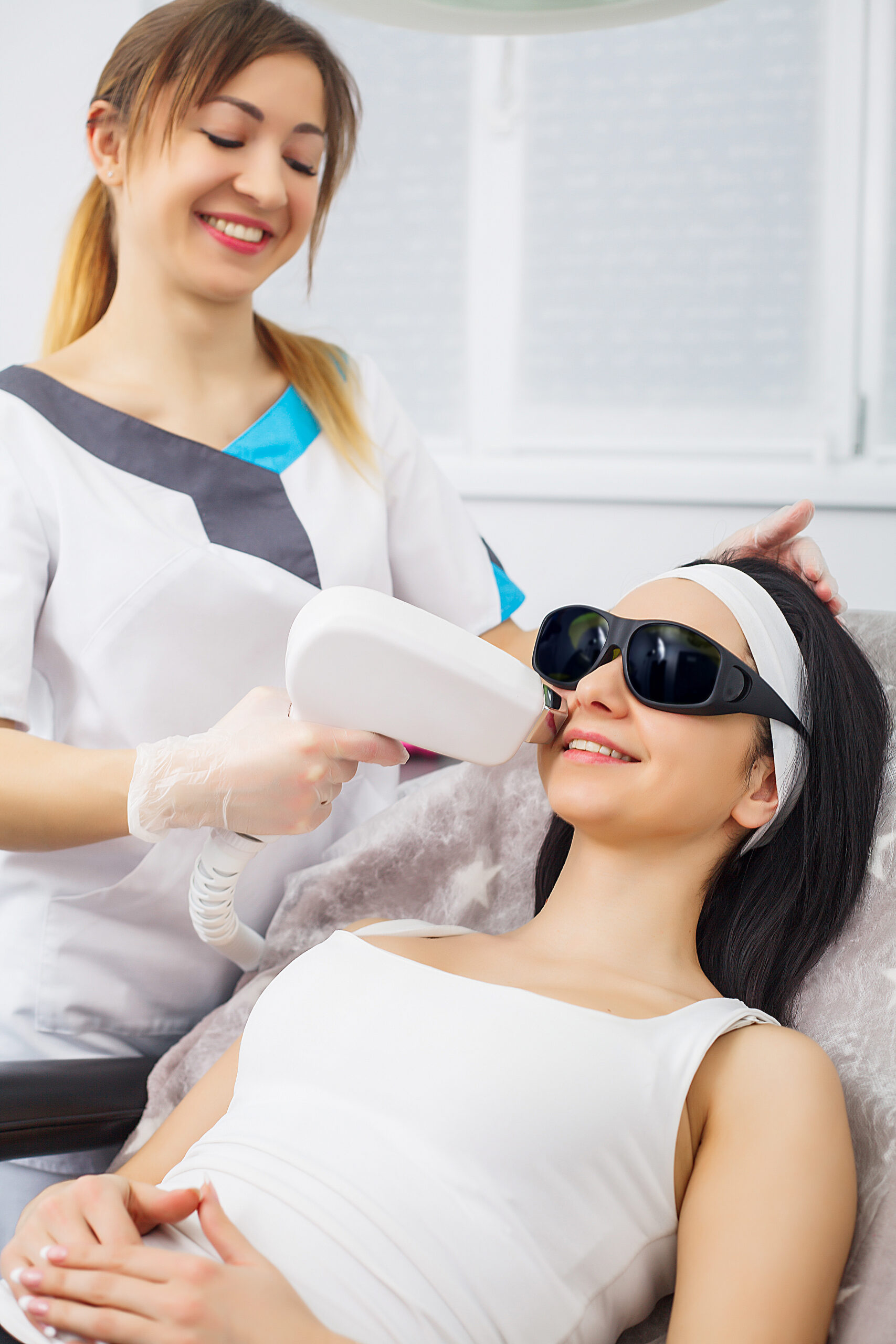 Laser epilation and cosmetology.at cosmetic beauty spa clinic. Hair removal cosmetology procedure from a therapist. Cosmetology and SPA concept